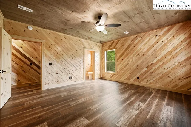 a view of an entryway with wooden floor