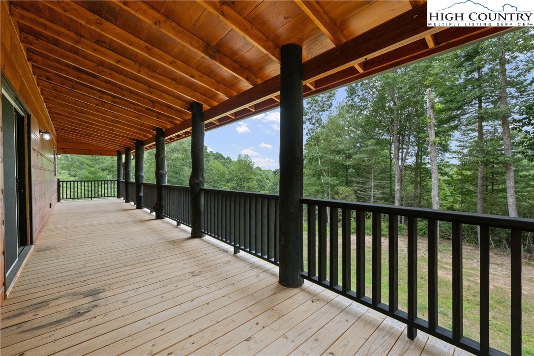 449 Hampton Ridge Road Fleetwood, NC 28626 - Photo 34 of 43 a view of a wooden deck
