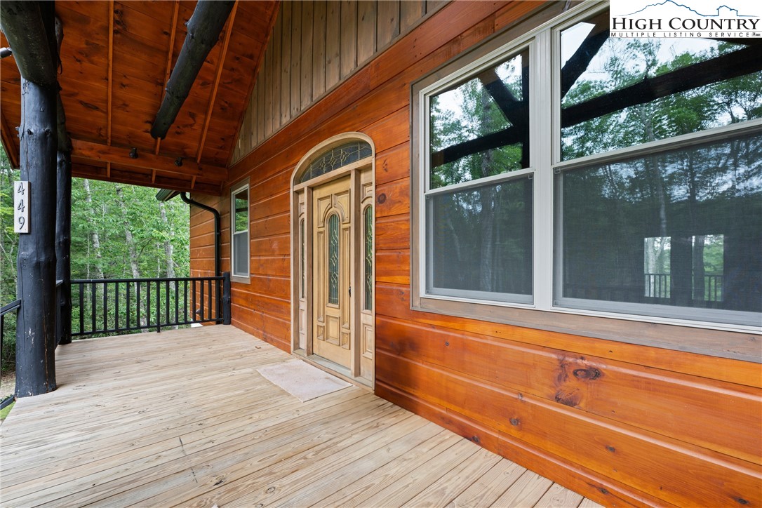 449 Hampton Ridge Road Fleetwood, NC 28626 - Photo 5 of 43 a view of a two room with wooden floor and walls