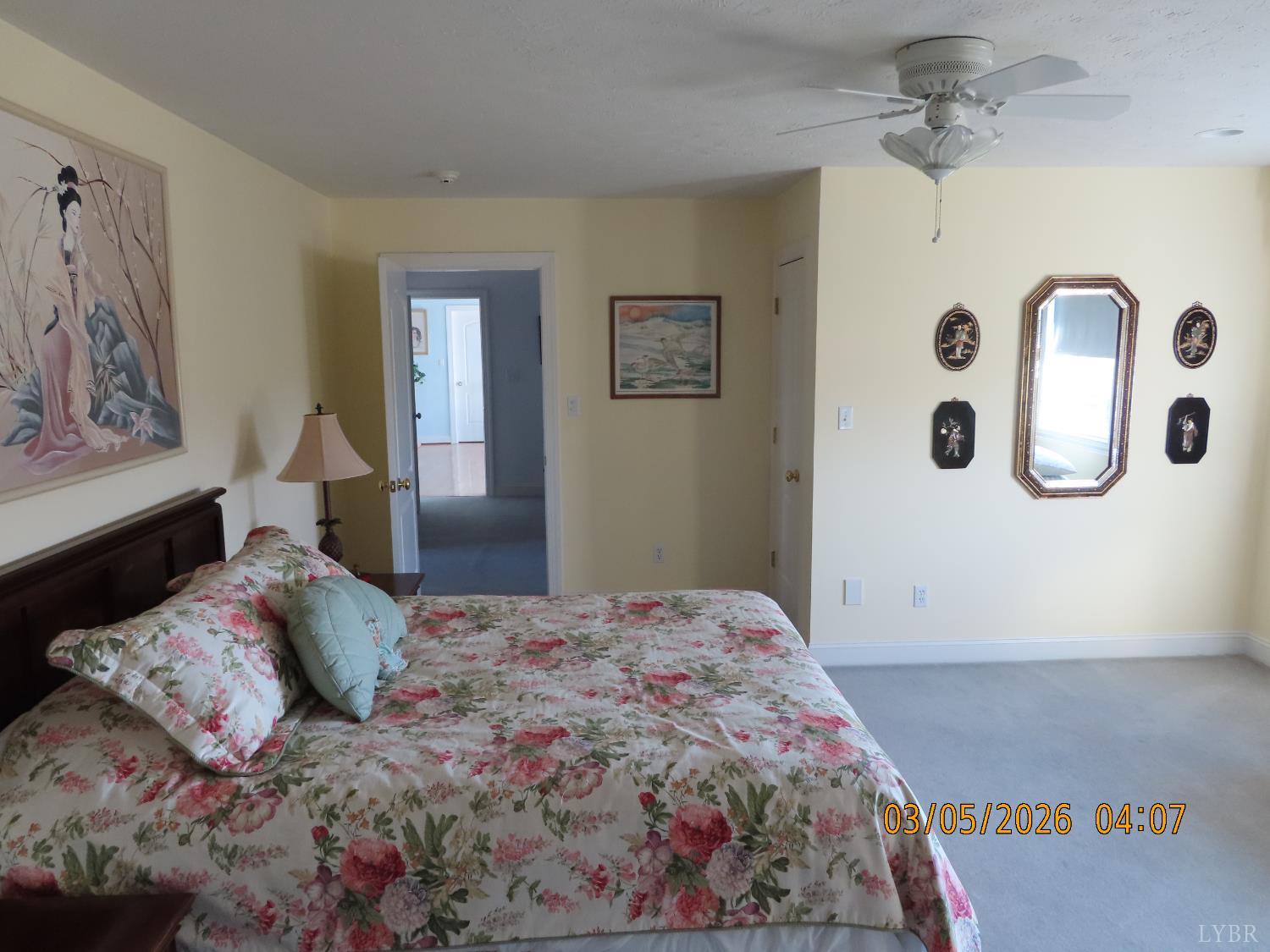 6485 Falling Creek Road Bedford, VA 24523 - Photo 21 of 50 a bedroom with a large bed and a chandelier