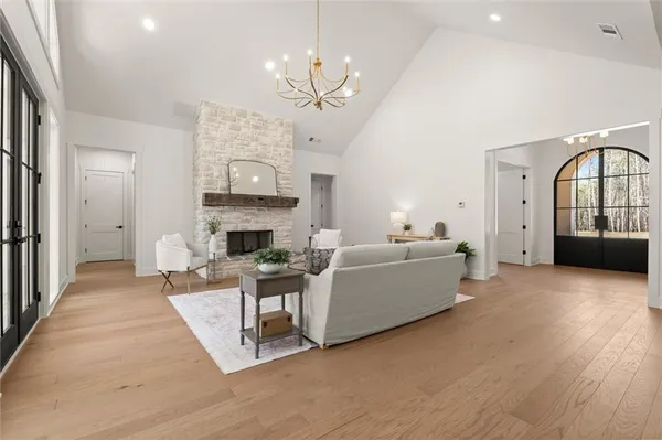 a kitchen with stainless steel appliances kitchen island a table and chairs in it