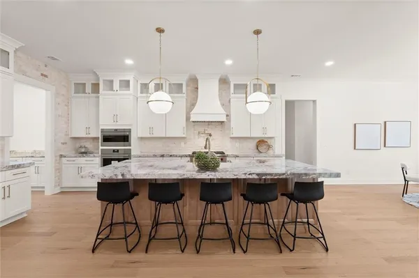 a kitchen with sink stove and cabinets