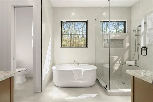 an empty room with a ceiling fan and carpet