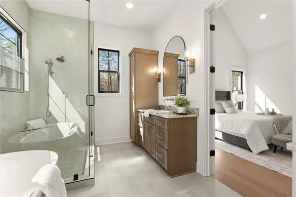a bathroom with a toilet sink and shower