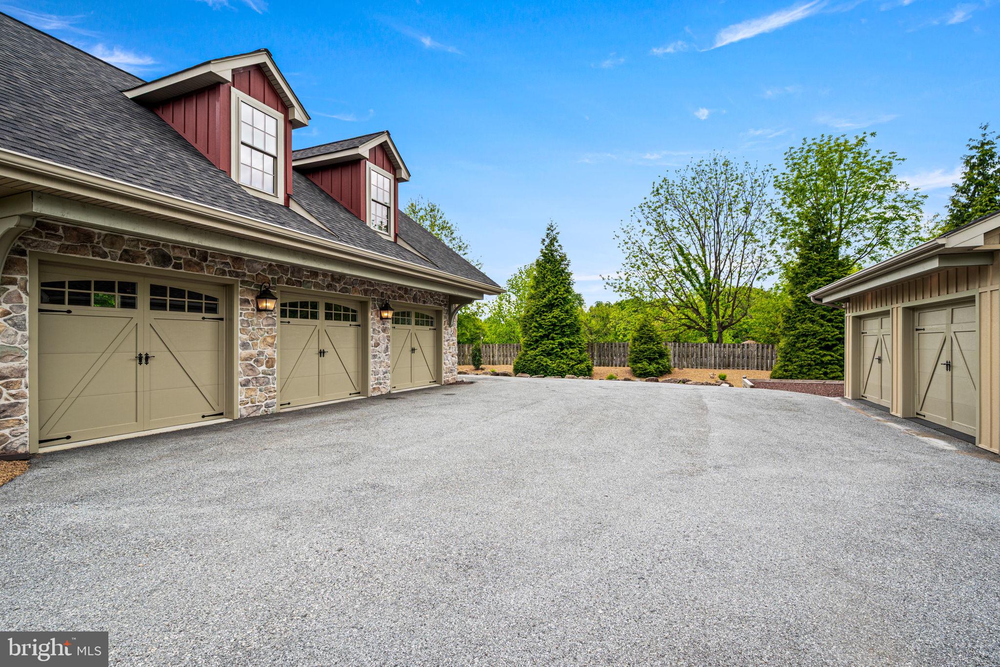 1548 Morstein Road Malvern, PA 19355 - Photo 66 of 80 a front view of a house with a yard and garage