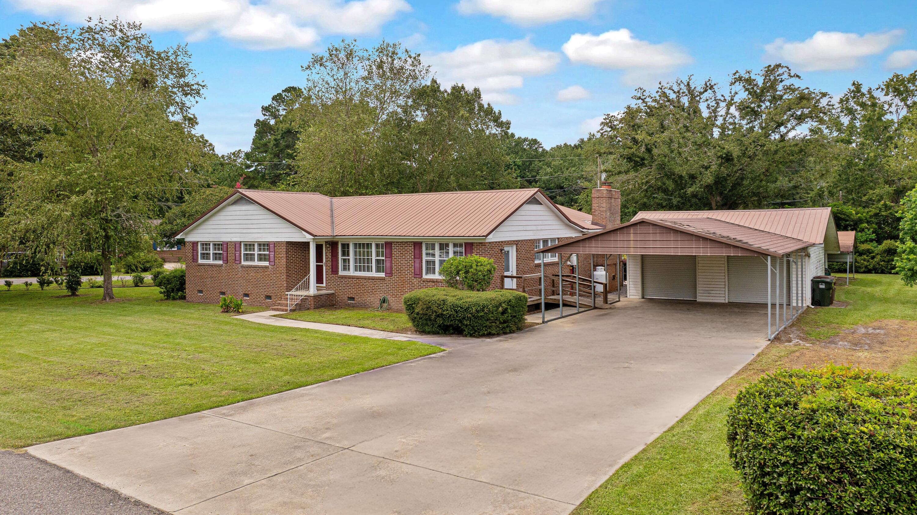 113 Center Street Moncks Corner, SC 29461 - Photo 25 of 31 driveway plus carport and 2 car garage