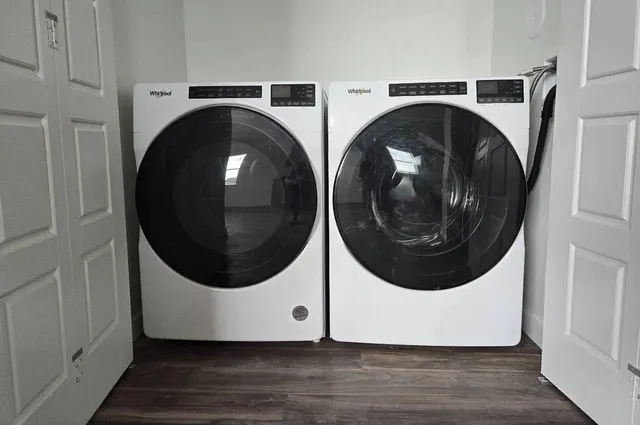 a utility room with dryer and washer
