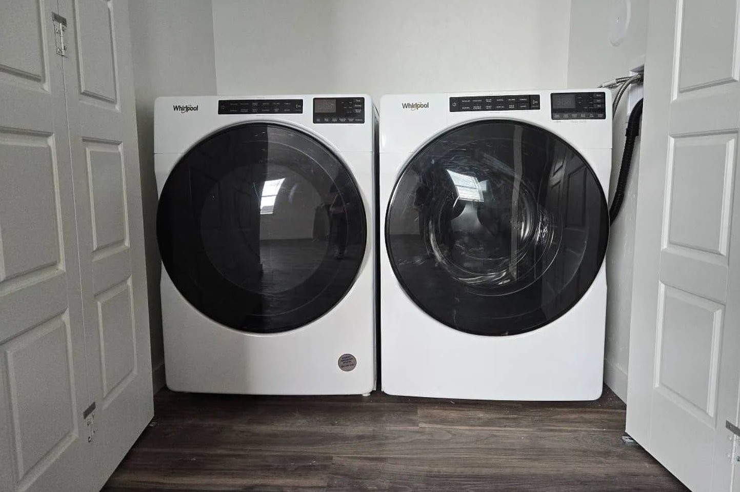 702 Makenzie River Road Fruita, CO 81521 - Photo 7 of 7 a utility room with dryer and washer