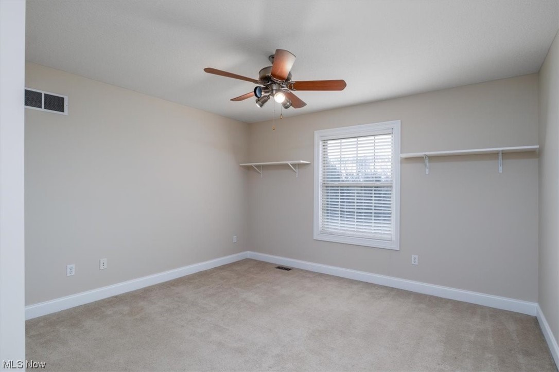 514 Silver Ridge Drive Akron, OH 44321 - Photo 31 of 47 Bedroom on 2nd level with ceiling fan and deep baseboard trim.
