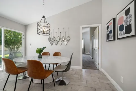a view of a dining room with furniture window and outside view