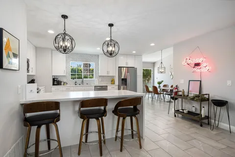 a view of a dining area with furniture window and wooden floor