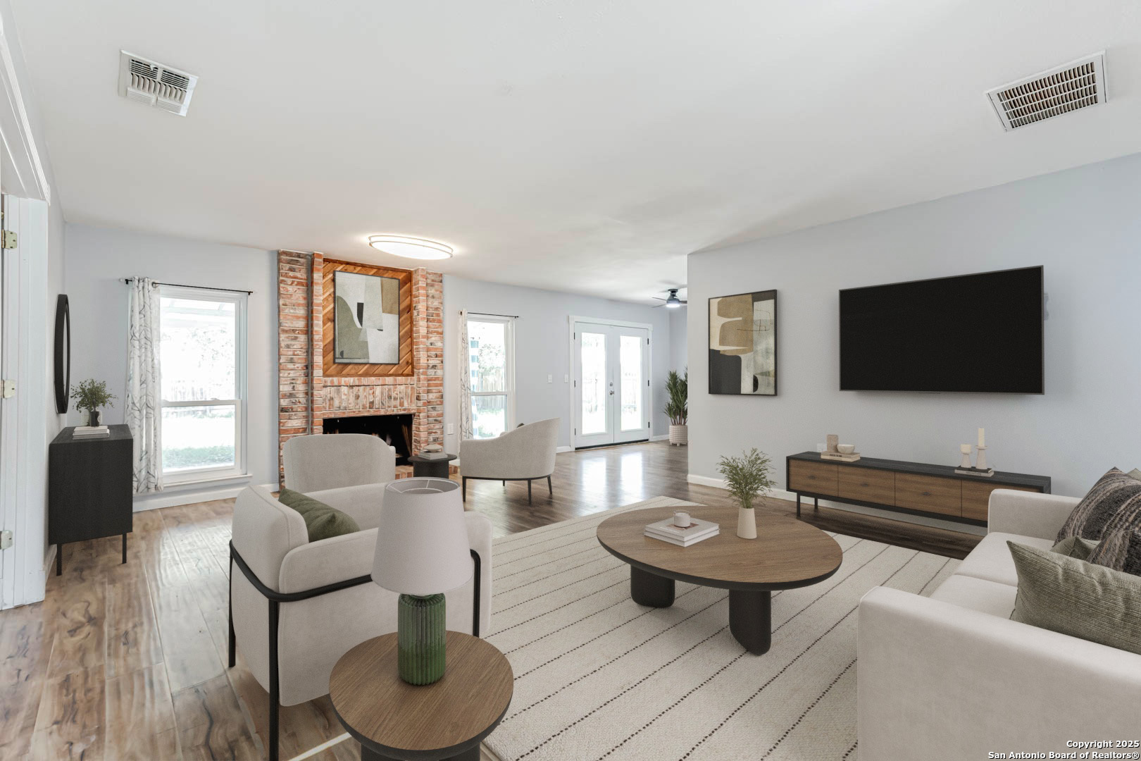 a living room with furniture and a flat screen tv