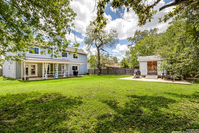 a front view of house with yard and seating area