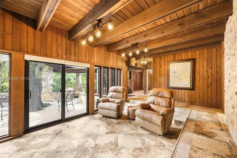 a kitchen that has a table and chairs in it