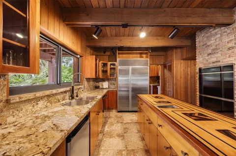 a view of a porch with chairs and furniture