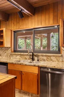a lobby with furniture and floor to ceiling window