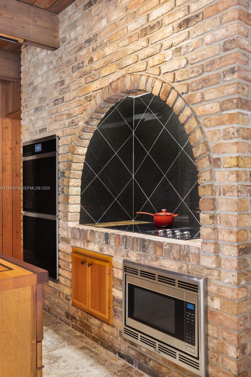 21675 Southwest 232nd Street Miami, FL 33170 - Photo 17 of 82 a close view of a stove and kitchen counter space