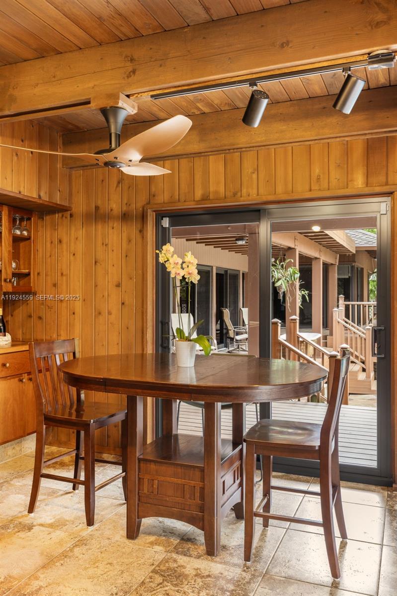 21675 Southwest 232nd Street Miami, FL 33170 - Photo 22 of 82 a view of a dining room with furniture and chandelier