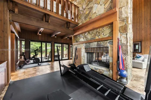 a view of a room with windows and stairs