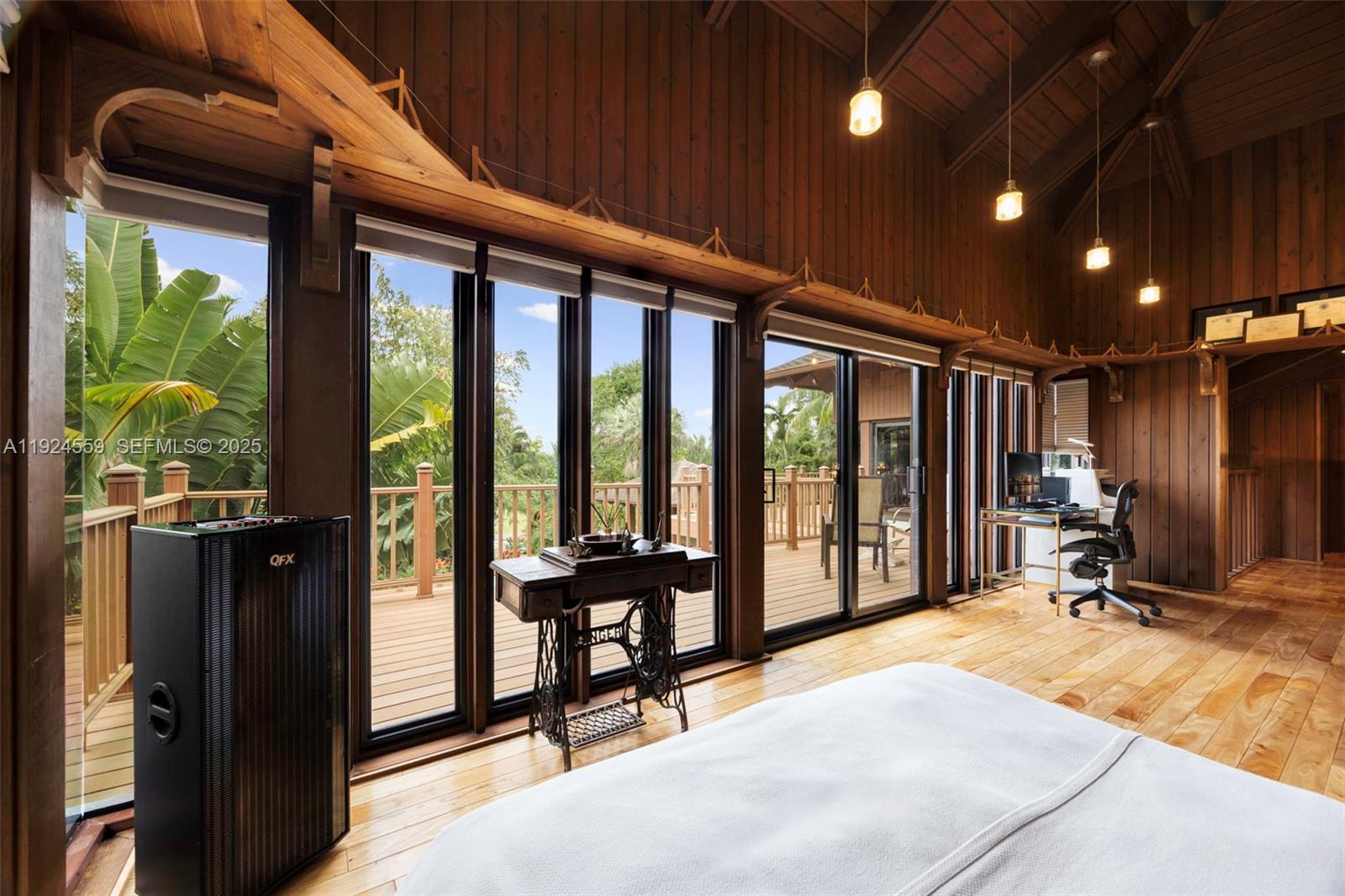 21675 Southwest 232nd Street Miami, FL 33170 - Photo 37 of 82 a view of a room with gym equipment and floor to ceiling window