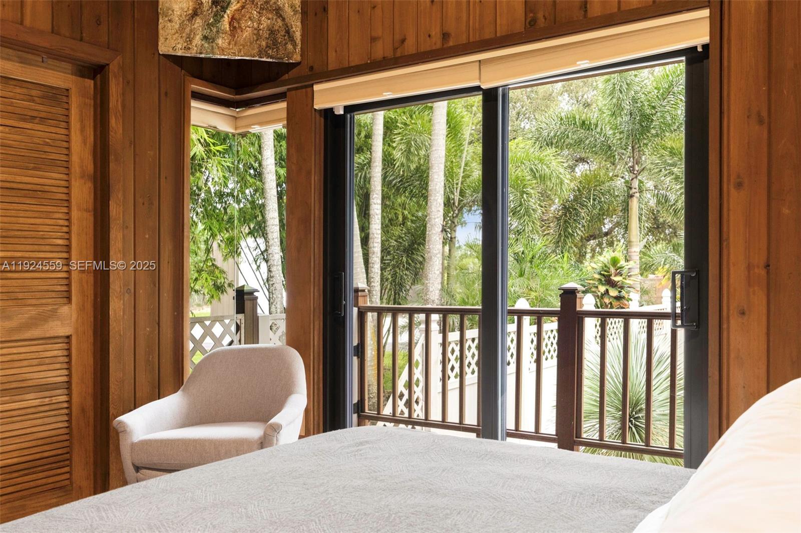 21675 Southwest 232nd Street Miami, FL 33170 - Photo 49 of 82 a bedroom with furniture and a large window