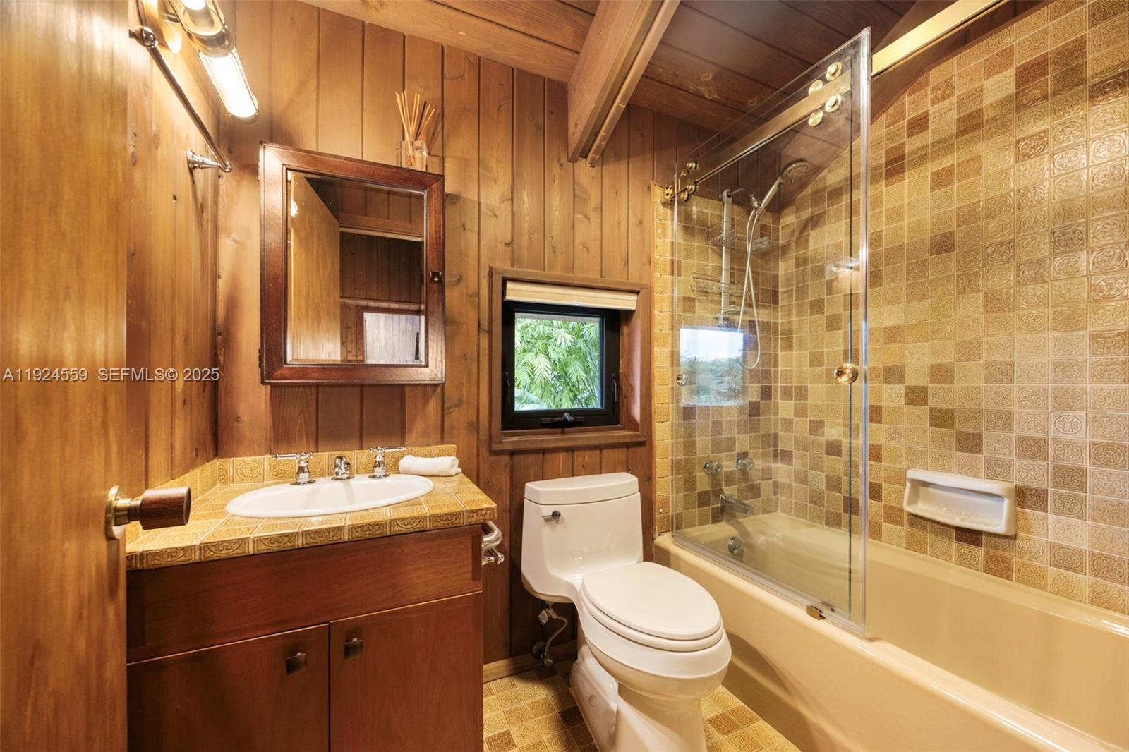 21675 Southwest 232nd Street Miami, FL 33170 - Photo 53 of 82 a bathroom with a sink toilet and shower