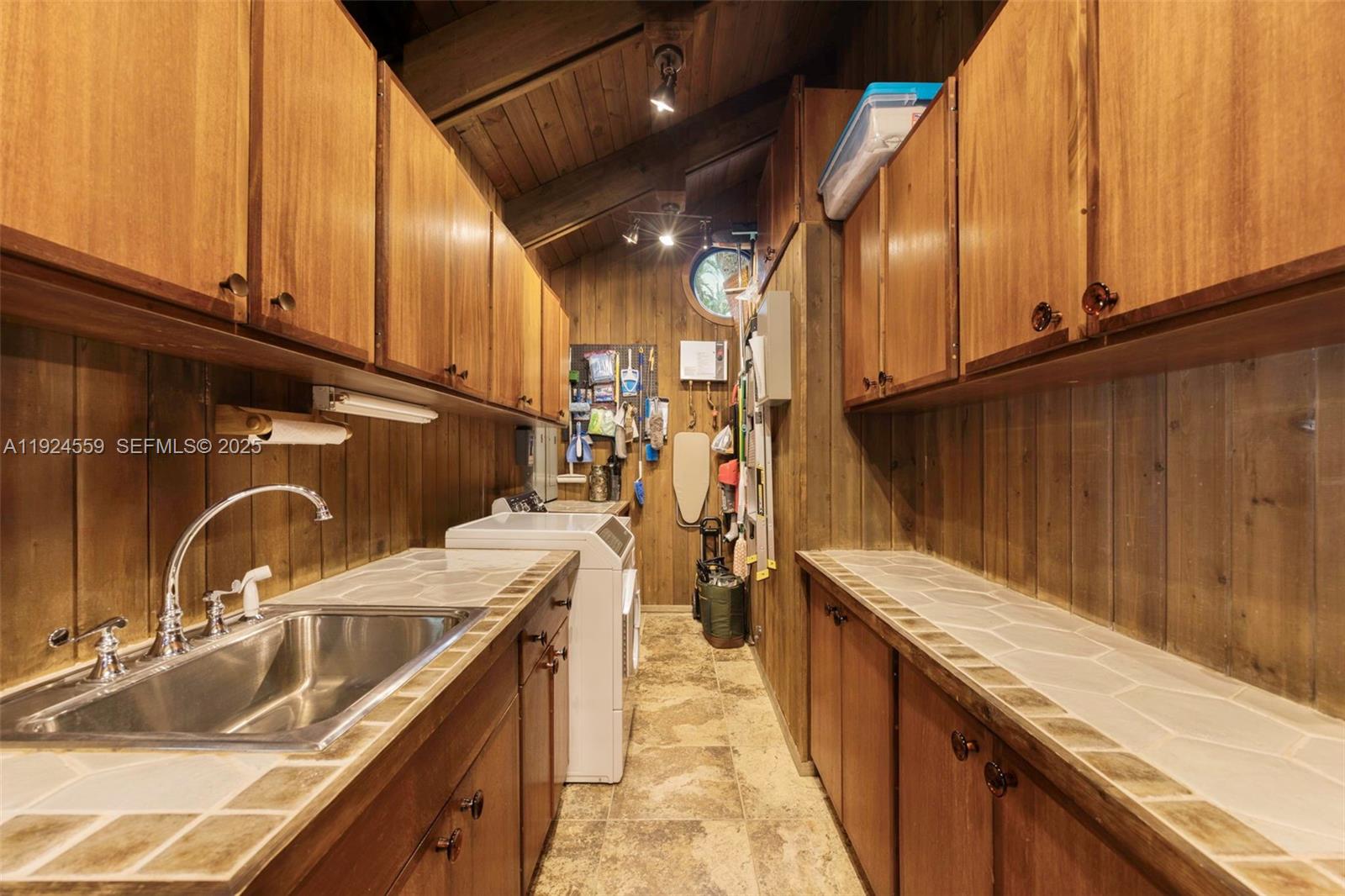 21675 Southwest 232nd Street Miami, FL 33170 - Photo 58 of 82 a kitchen with a sink and cabinets