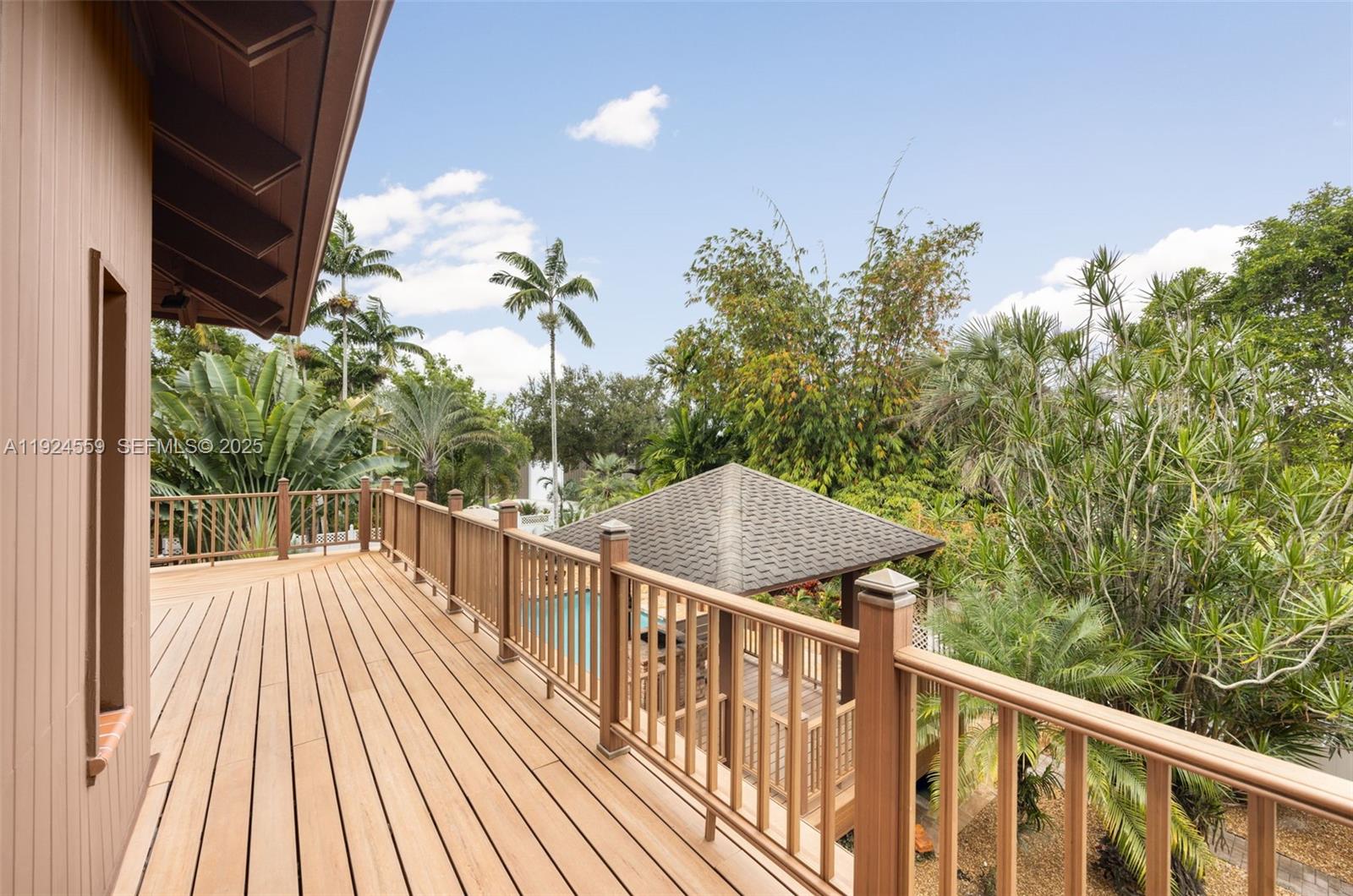 21675 Southwest 232nd Street Miami, FL 33170 - Photo 60 of 82 a view of a balcony with wooden floor