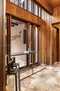 a large kitchen with stainless steel appliances granite countertop a refrigerator and a sink