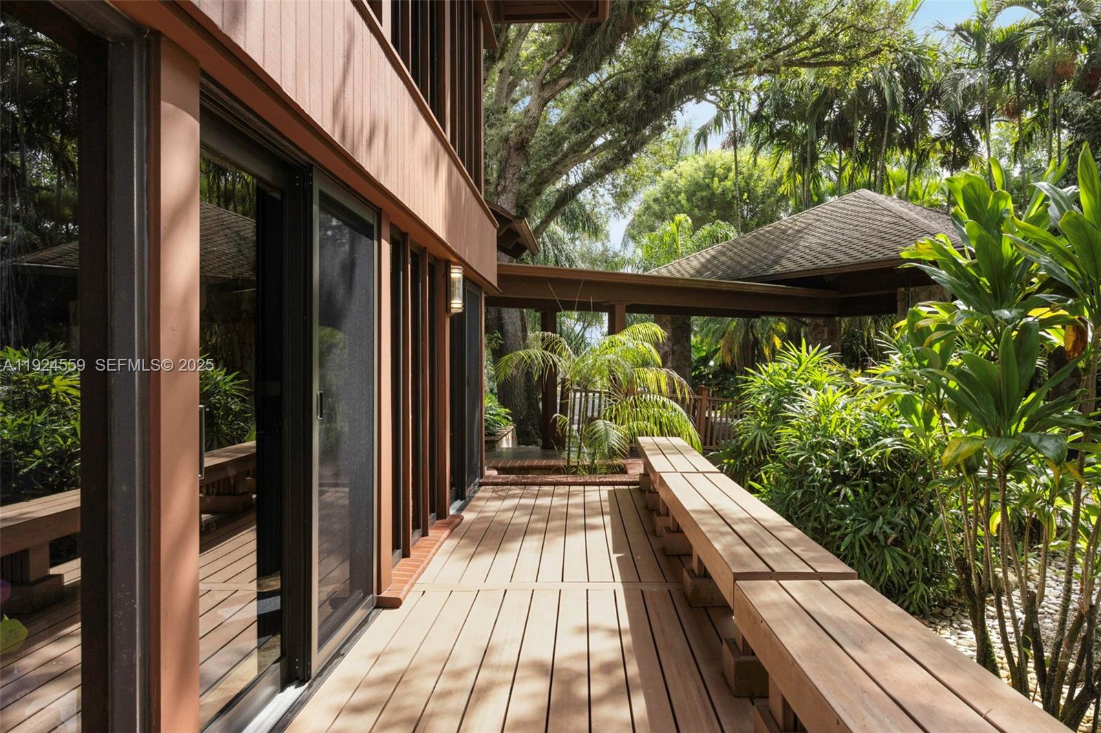 21675 Southwest 232nd Street Miami, FL 33170 - Photo 73 of 82 a view of balcony and floor to ceiling window
