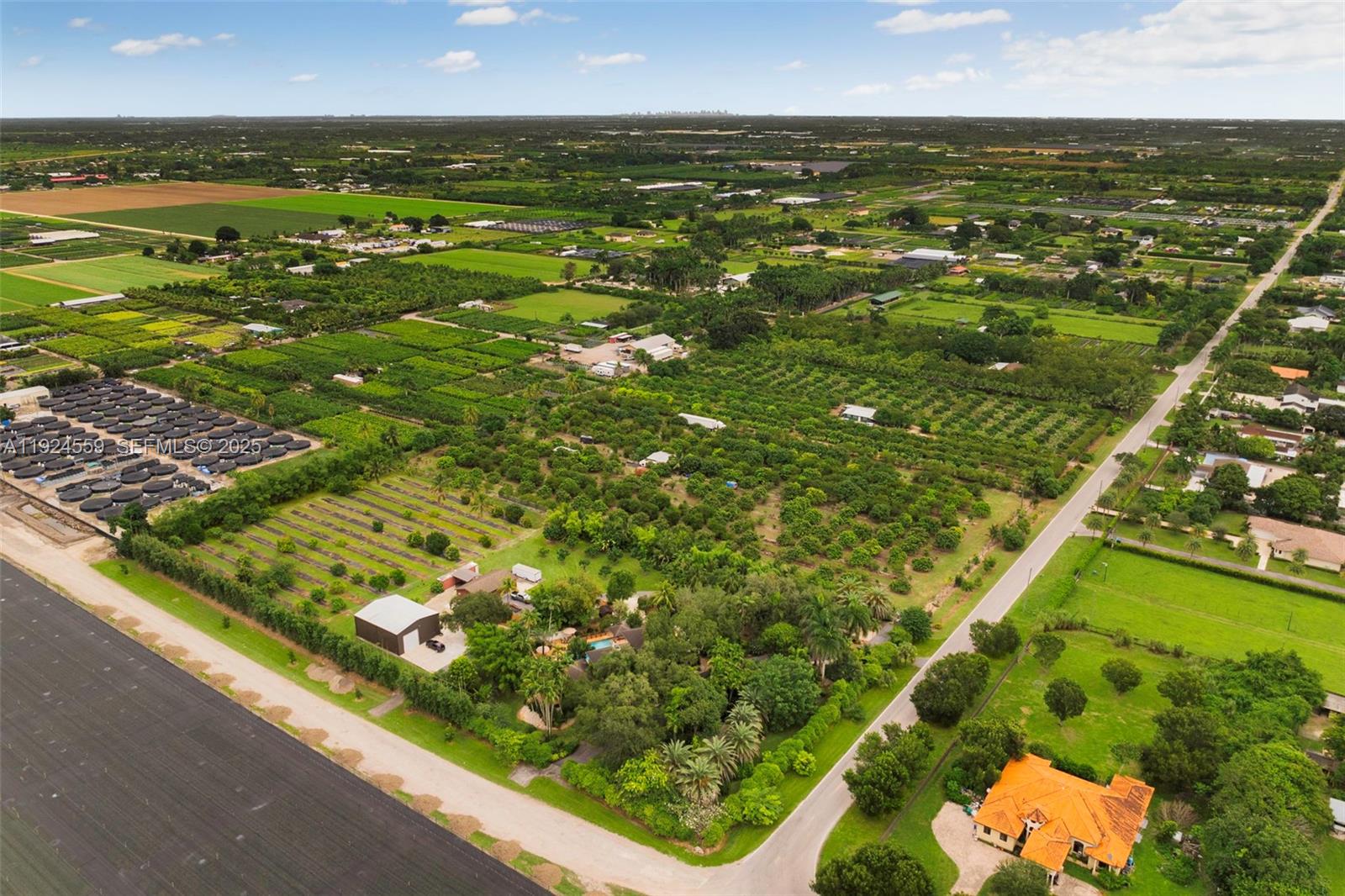 21675 Southwest 232nd Street Miami, FL 33170 - Photo 81 of 82 an aerial view of residential houses with outdoor space and trees