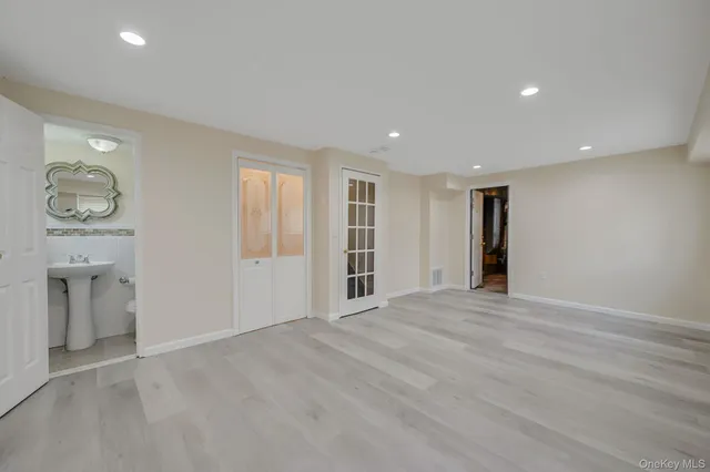 a bathroom with a sink and a mirror