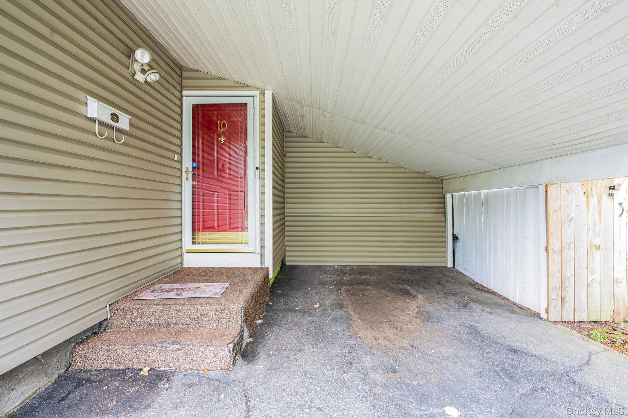 10 Laurie Road Brentwood, NY 11717 - Photo 24 of 29 Entrance to property with a carport and driveway
