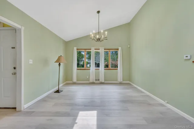 a kitchen with stainless steel appliances a stove a sink and a refrigerator