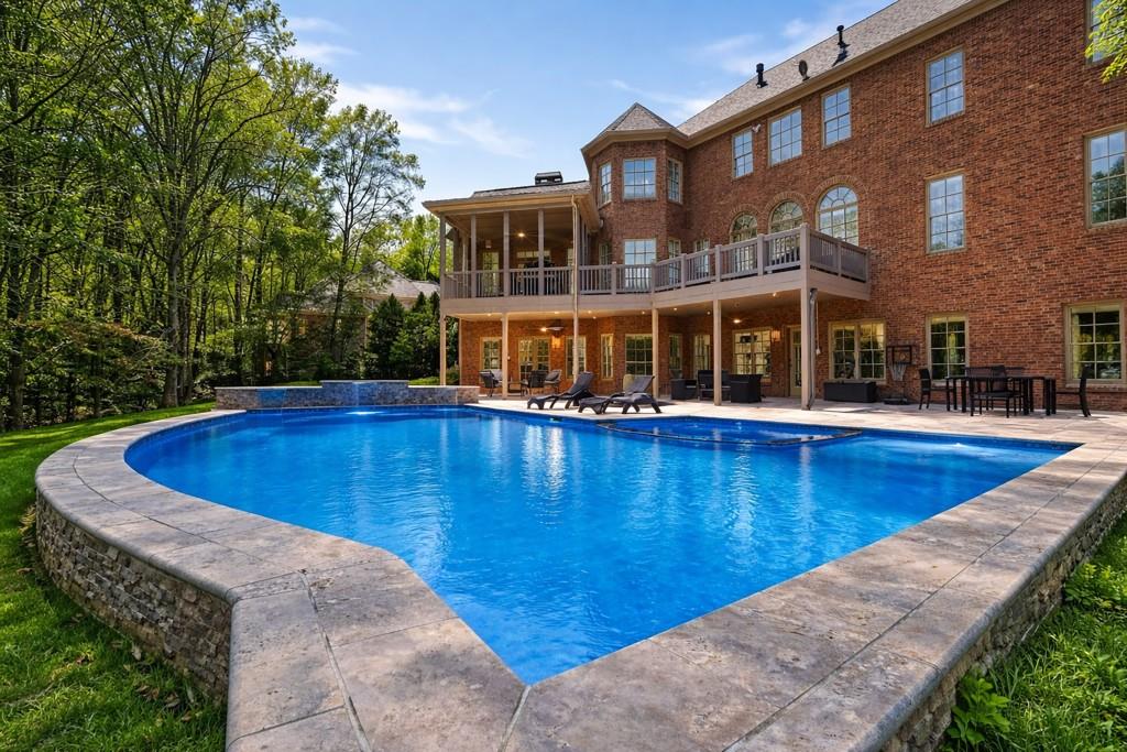 a view of a swimming pool with an outdoor seating