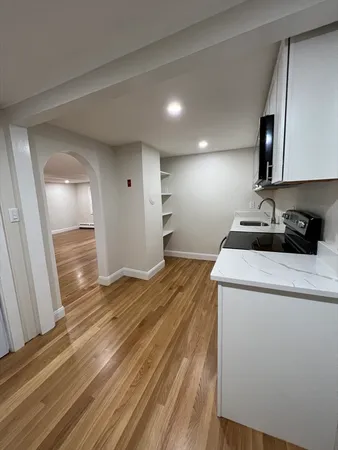 a view of a storage & utility room with wooden floor