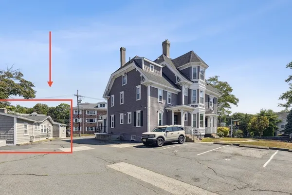 a view of a street with of a house in the background