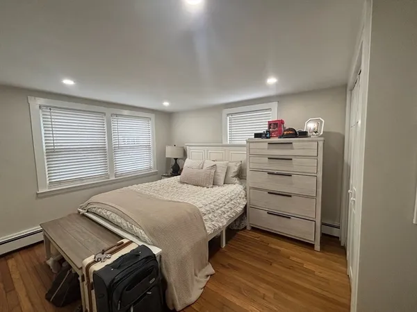 a bed room with a bed and a window