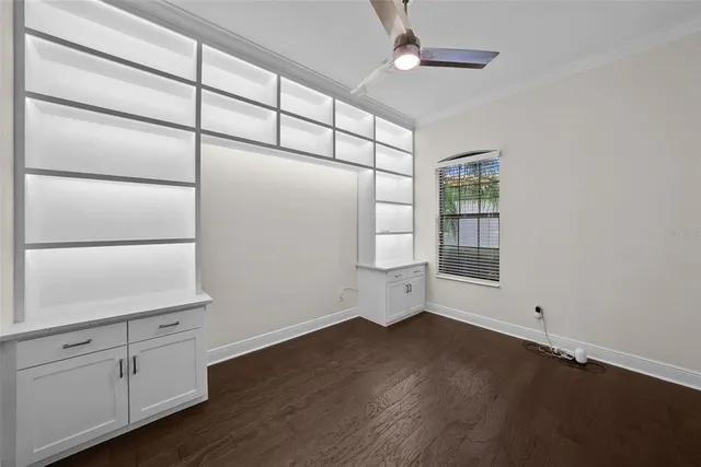 a bathroom with a granite countertop sink toilet and a mirror