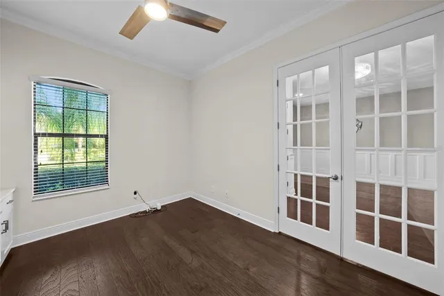 a black and white kitchen with a large window