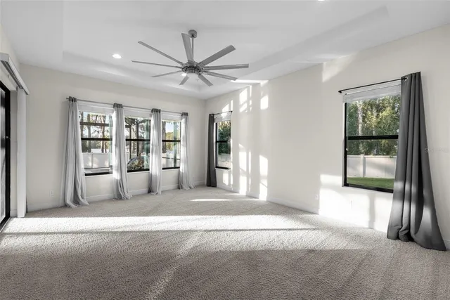 a black and white building with wooden floor