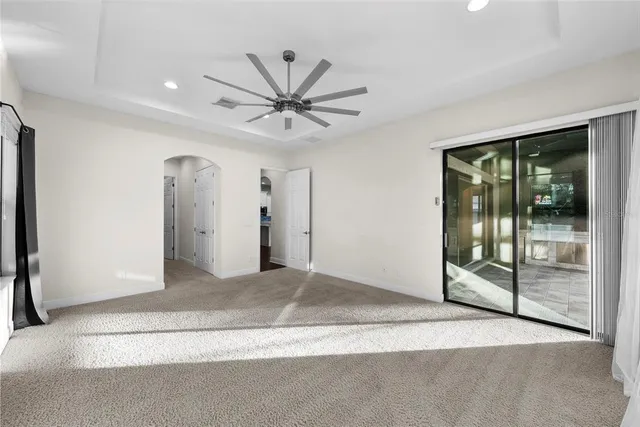 a bathroom with a sink a large mirror and a bathtub
