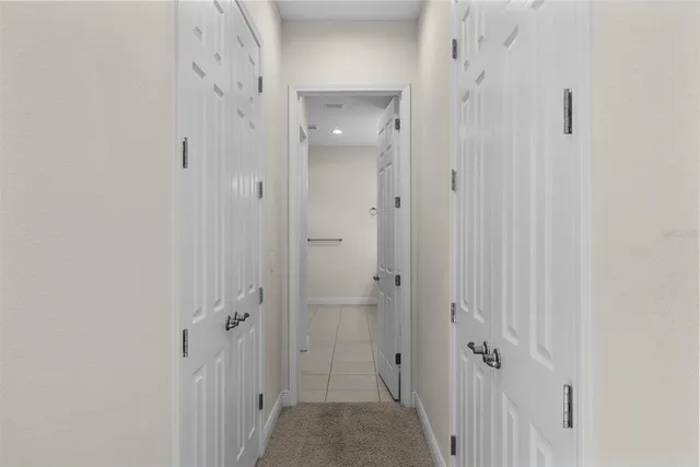 a bathroom with a white toilet and a bath tub