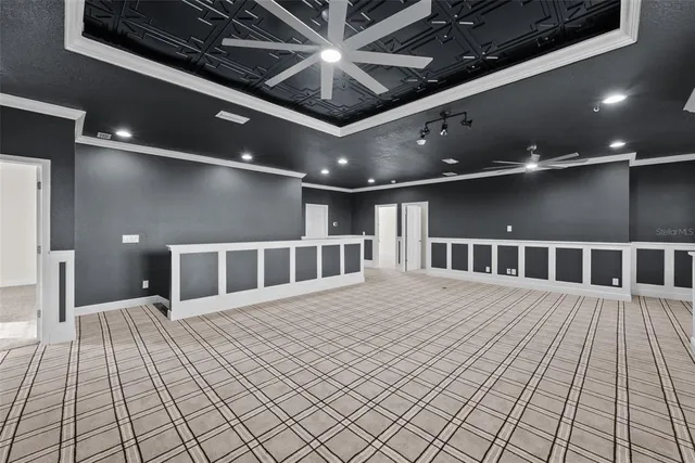 a view of house with yard and a garage