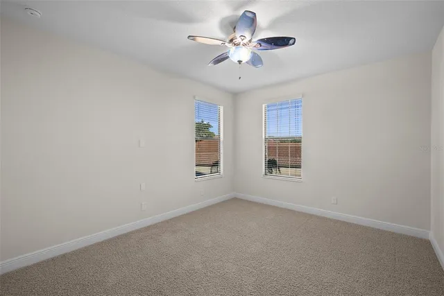 a view of swimming pool with seating area