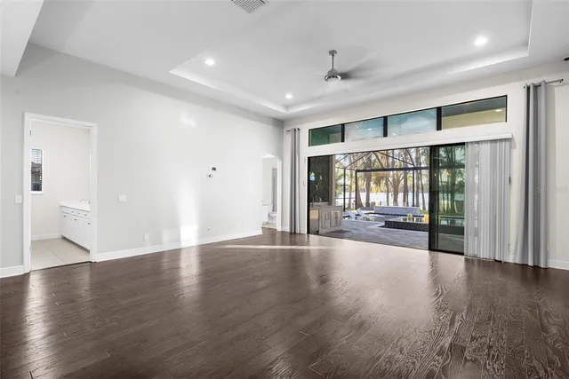 a kitchen with stainless steel appliances granite countertop a sink a stove and a refrigerator