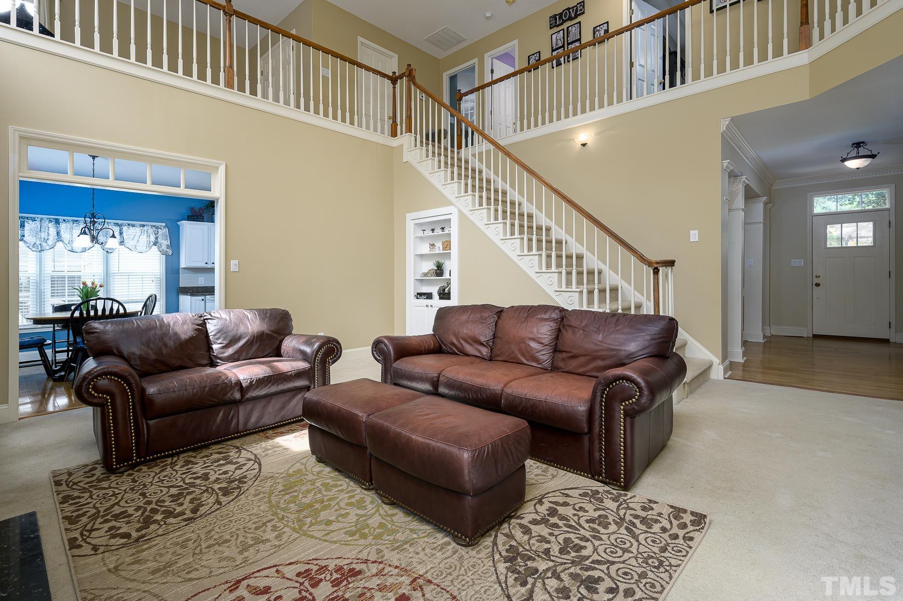 701 Modena Drive Cary, NC 27513 - Photo 14 of 39 a living room with furniture and a window