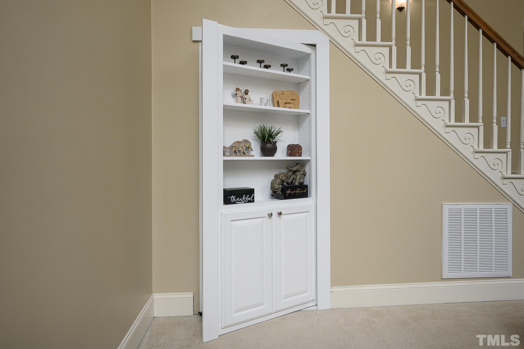 701 Modena Drive Cary, NC 27513 - Photo 19 of 39 a view of a hallway with white cabinets and white appliances