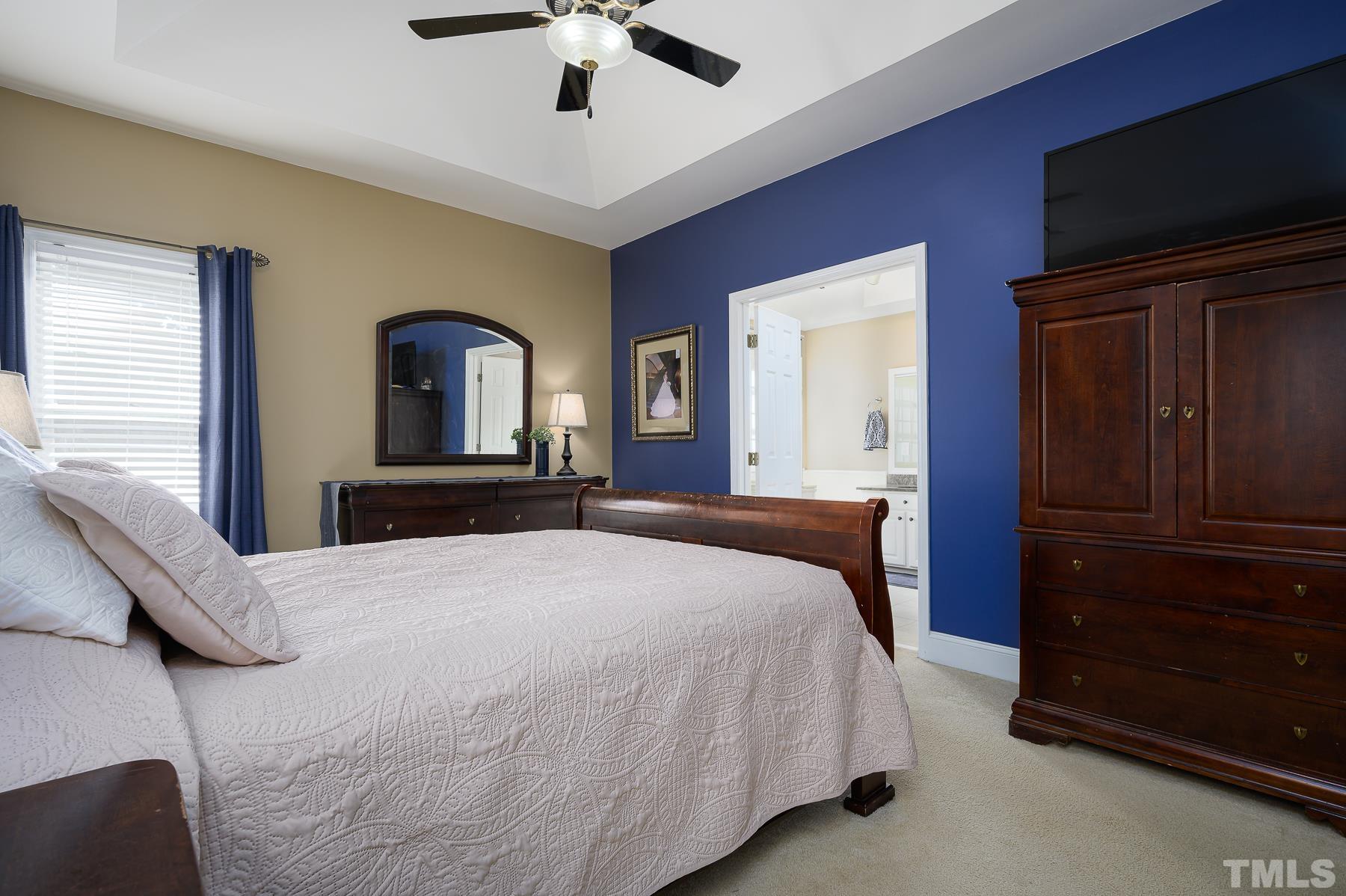 701 Modena Drive Cary, NC 27513 - Photo 21 of 39 a bedroom with a bed and a dresser