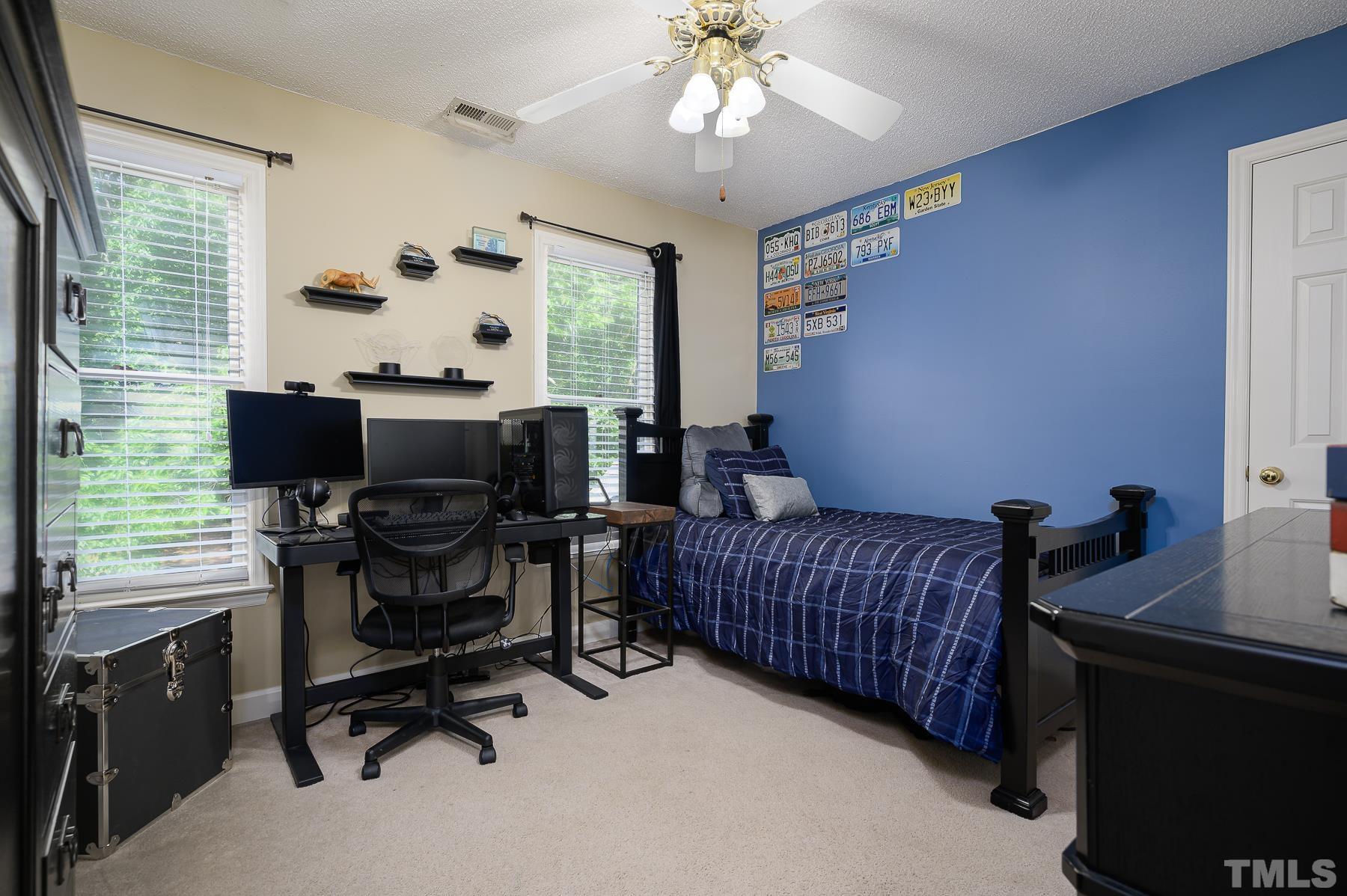 701 Modena Drive Cary, NC 27513 - Photo 27 of 39 a bedroom with furniture and a window